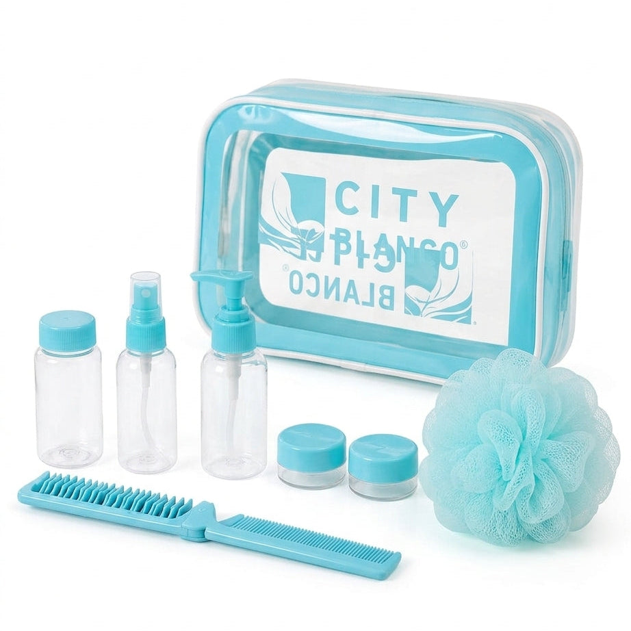A toiletry kit set with a light blue and white zippered case, three clear bottles, two small jars, a blue-and-white comb, and a light blue loofah sponge on a white background. The case label shows the brand name 'CITY BLANCO'.