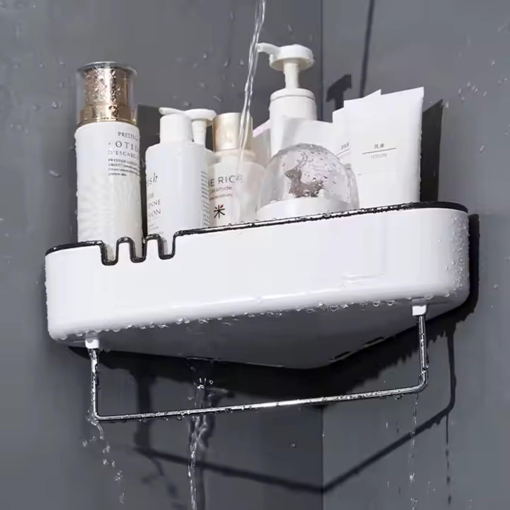 White shower caddy with bath products on a gray wall with water droplets.