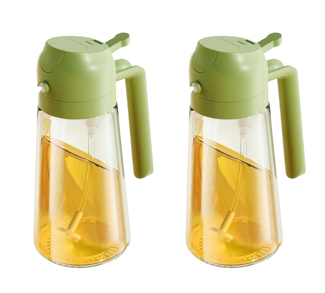 Two clear glass oil bottles with light green plastic pump lids and handles, filled with yellow oil, shown on a white background.
