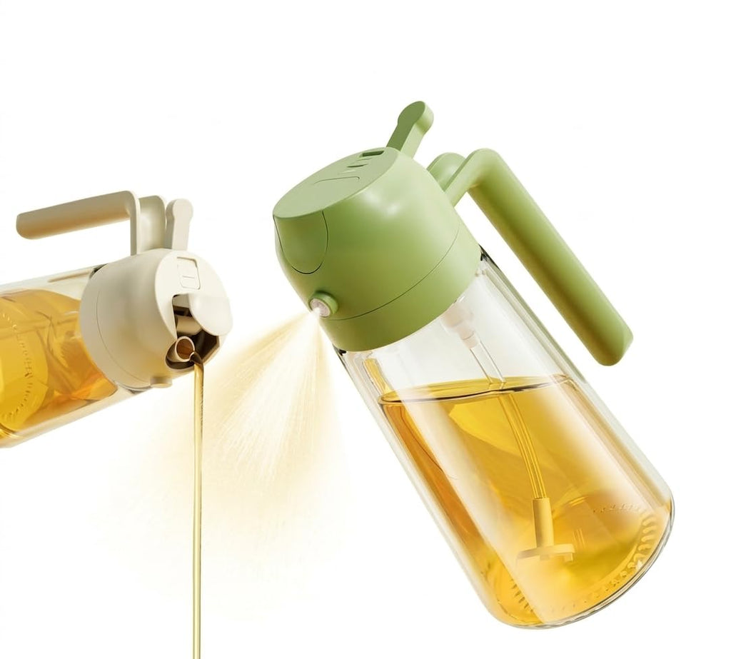 A clear plastic oil dispenser bottle with a light green pump handle and cap, shown filled with golden oil. One bottle is shown dispensing oil in a spray, and another is shown close-up on the left.