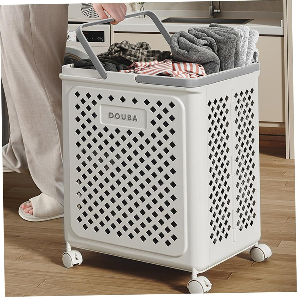 Person pushing a laundry basket filled with clothes in a kitchen.