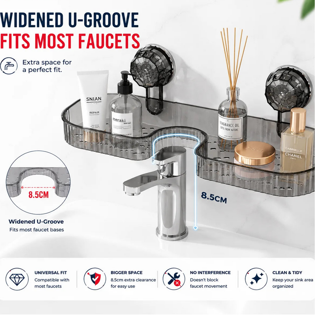 Transparent acrylic bathroom sink wall organizer with a widened U-shaped base, shown mounted above a chrome faucet. The organizer holds a diffuser, lotion tube, soap dispenser, and small jar.