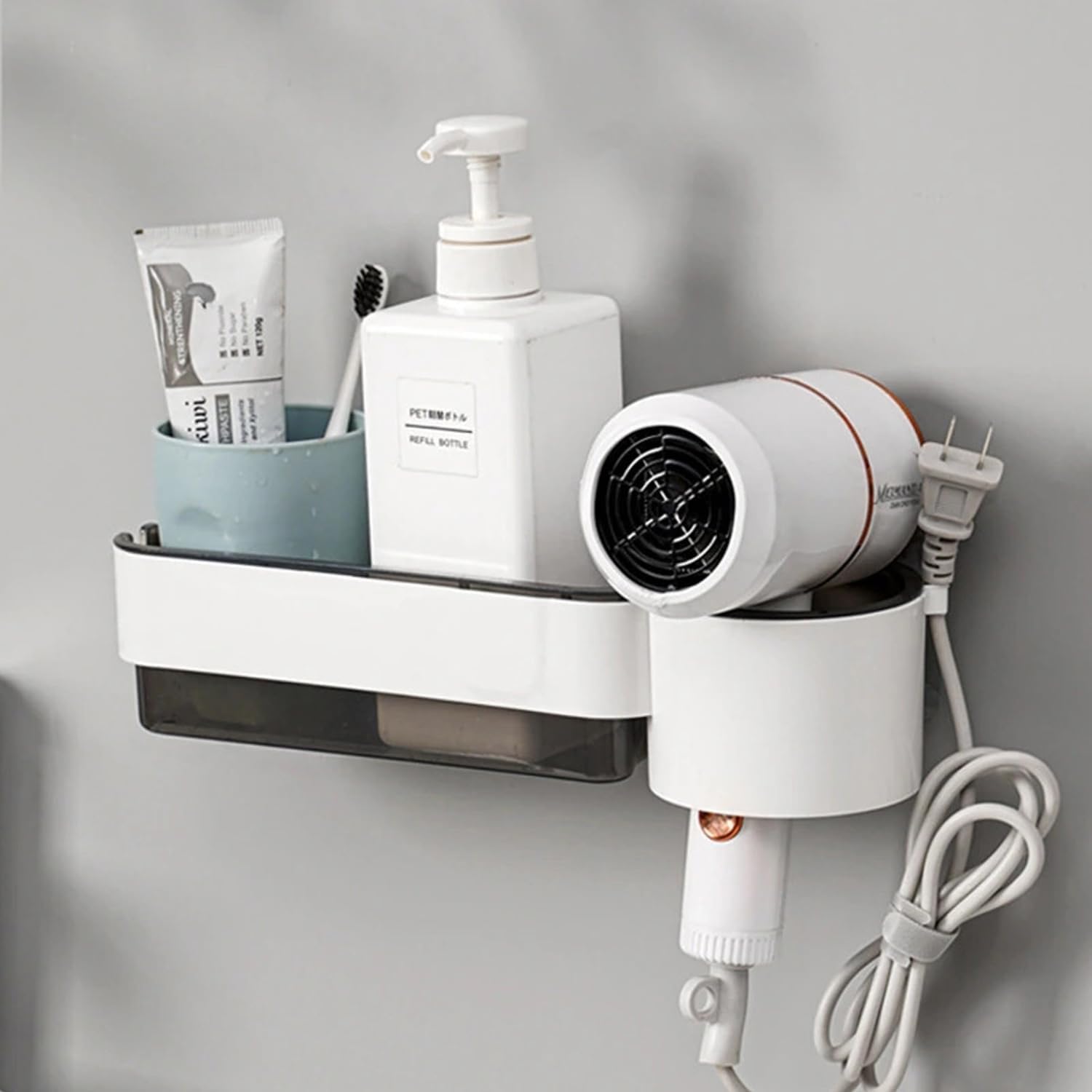 Wall-mounted organizer with toiletries and a hair dryer on a gray background