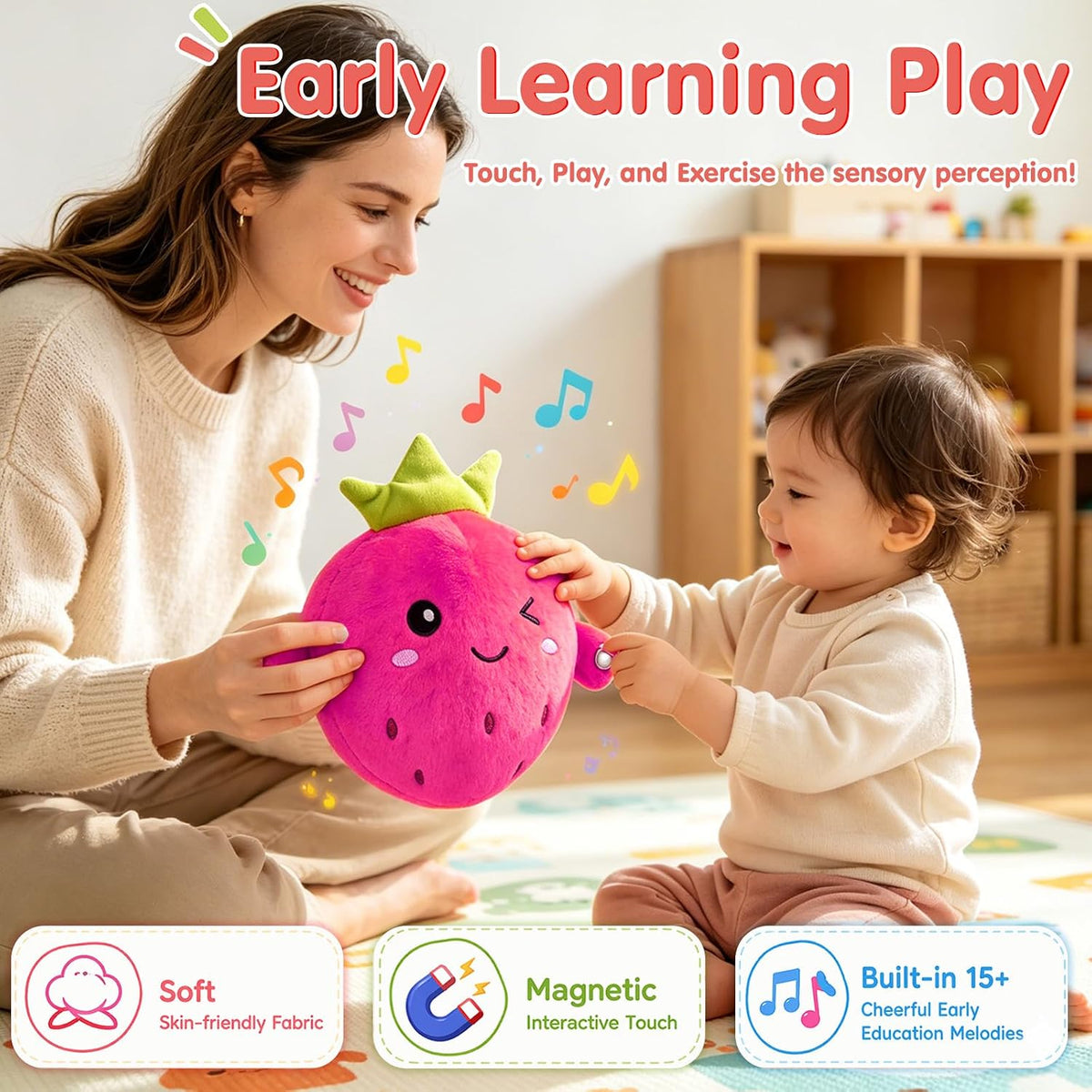 A woman and a toddler sit on a colorful play mat indoors, interacting with a pink plush strawberry toy that has a green crown and musical note details. The scene includes marketing text reading 'Early Learning Play' and feature badges for soft skin-friendly fabric, magnetic interactive touch, and built-in 15+ educational melodies.
