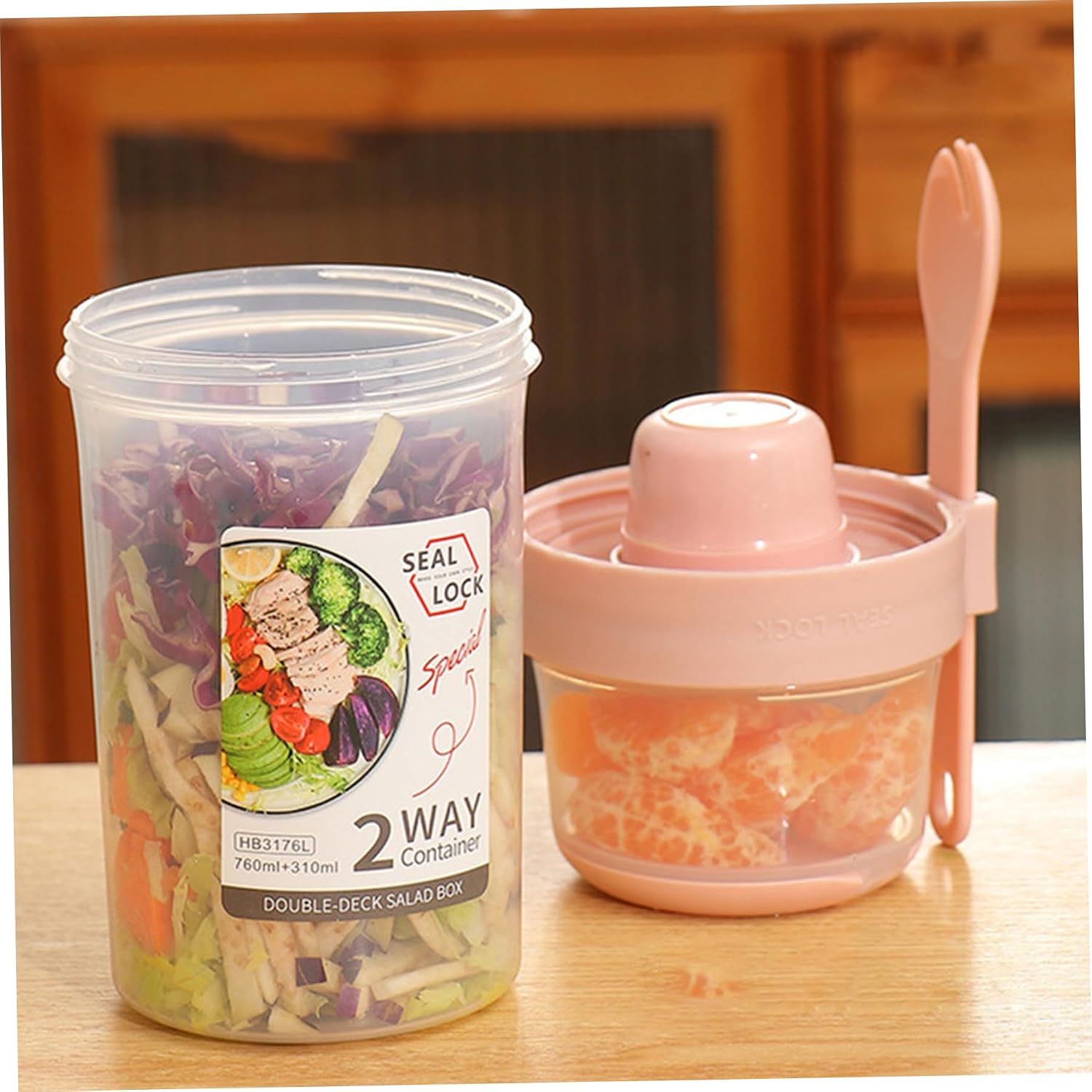 Two-way salad and yogurt container showing separate compartments, dressing cup and fork