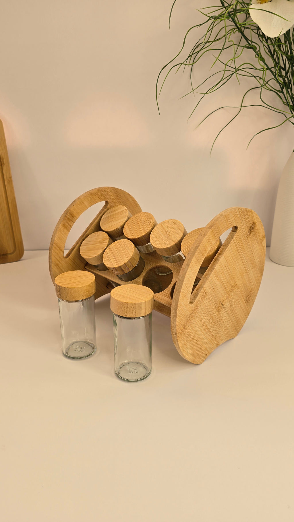 Bamboo spice rack with two removable glass jars displayed in front
