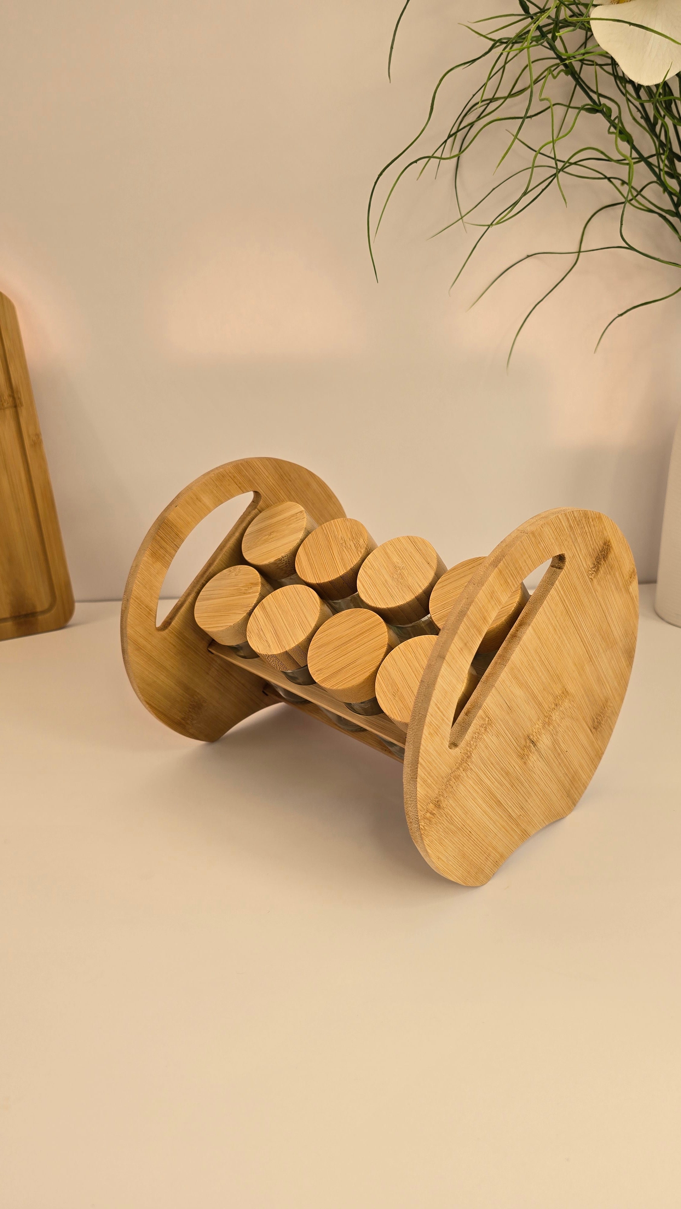 Side view of the Beiryta bamboo spice rack with eight glass jars
