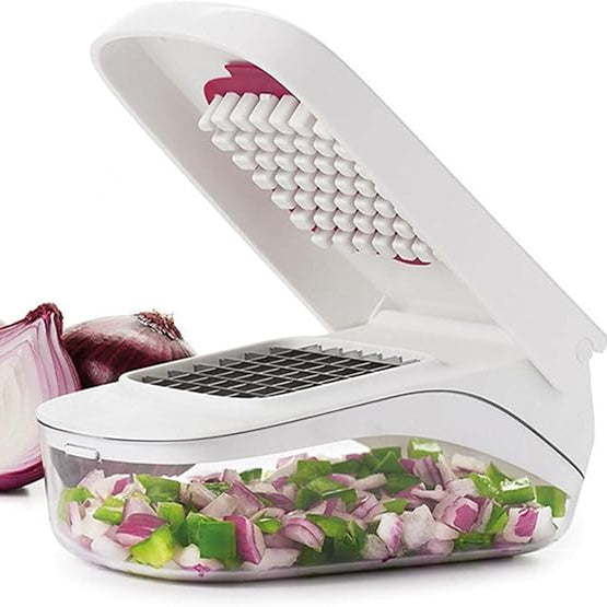 White vegetable chopper with chopped vegetables and whole onions on a white background