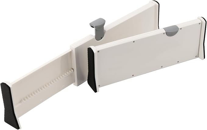 A white plastic baby support belt or waist belt with black protective corner guards and gray plastic adjustment knobs, shown on a solid white background.