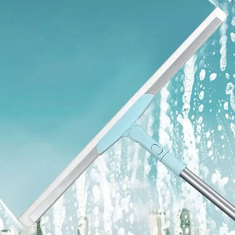 Light blue Beiryta extendable squeegee removing soap and water from glass.