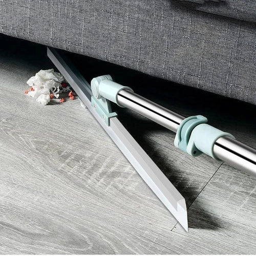 Beiryta rotating floor squeegee cleaning debris and dust from underneath a sofa.