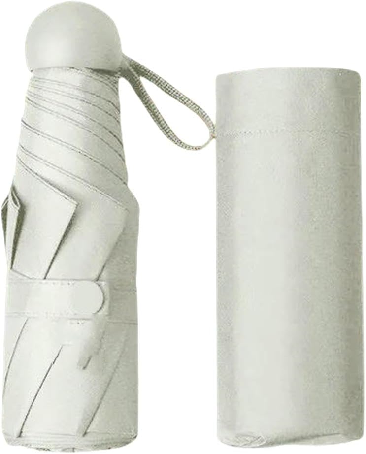 A compact umbrella shown folded next to its matching cylindrical storage case on a plain white background.