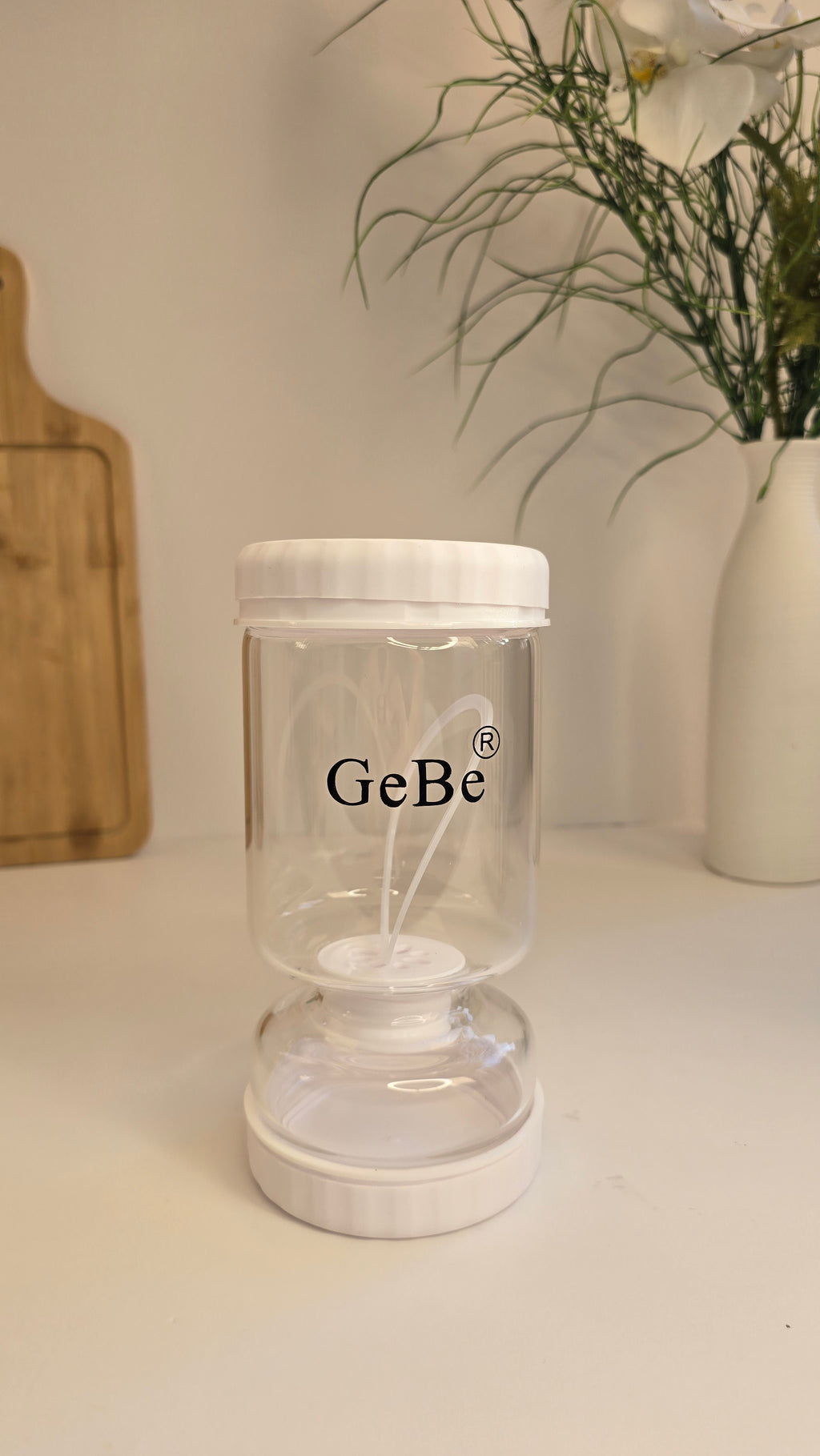 Empty Beiryta glass fermentation jar with water-seal lid on a kitchen countertop.