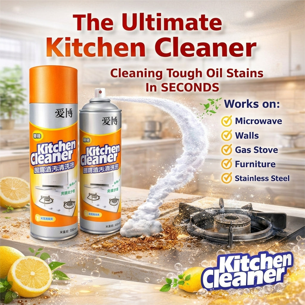 Two cans of Kitchen Cleaner spray shown on a kitchen countertop with a gas stove, lemon slices, and a foaming cleaning spray arc. Large text reads 'The Ultimate Kitchen Cleaner' and 'Cleaning Tough Oil Stains In Seconds,' with a 'Works on:' list including microwave, walls, gas stove, furniture, and stainless steel.