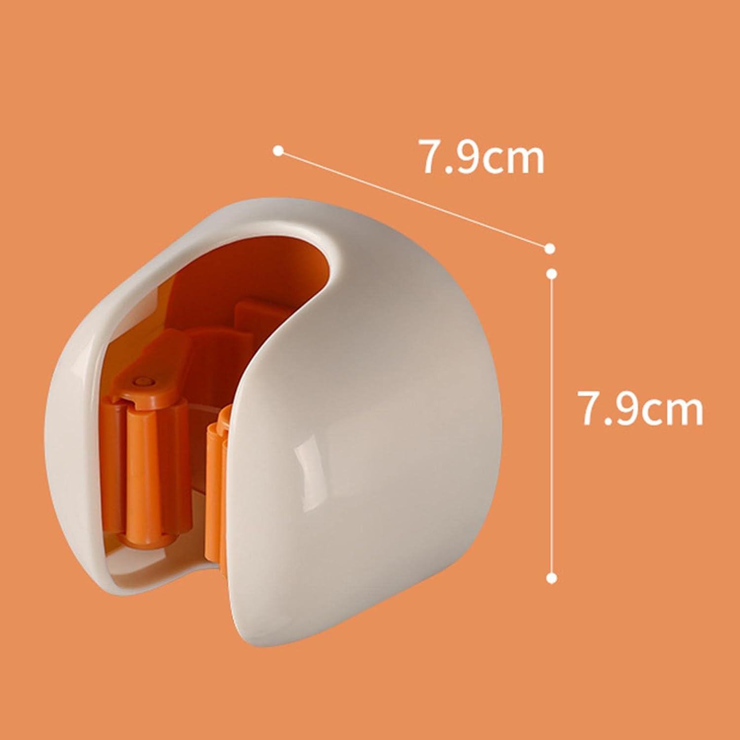 A white and orange plastic wall-mounted holder shown on an orange background with dimension lines indicating a height and width of 7.9 cm.