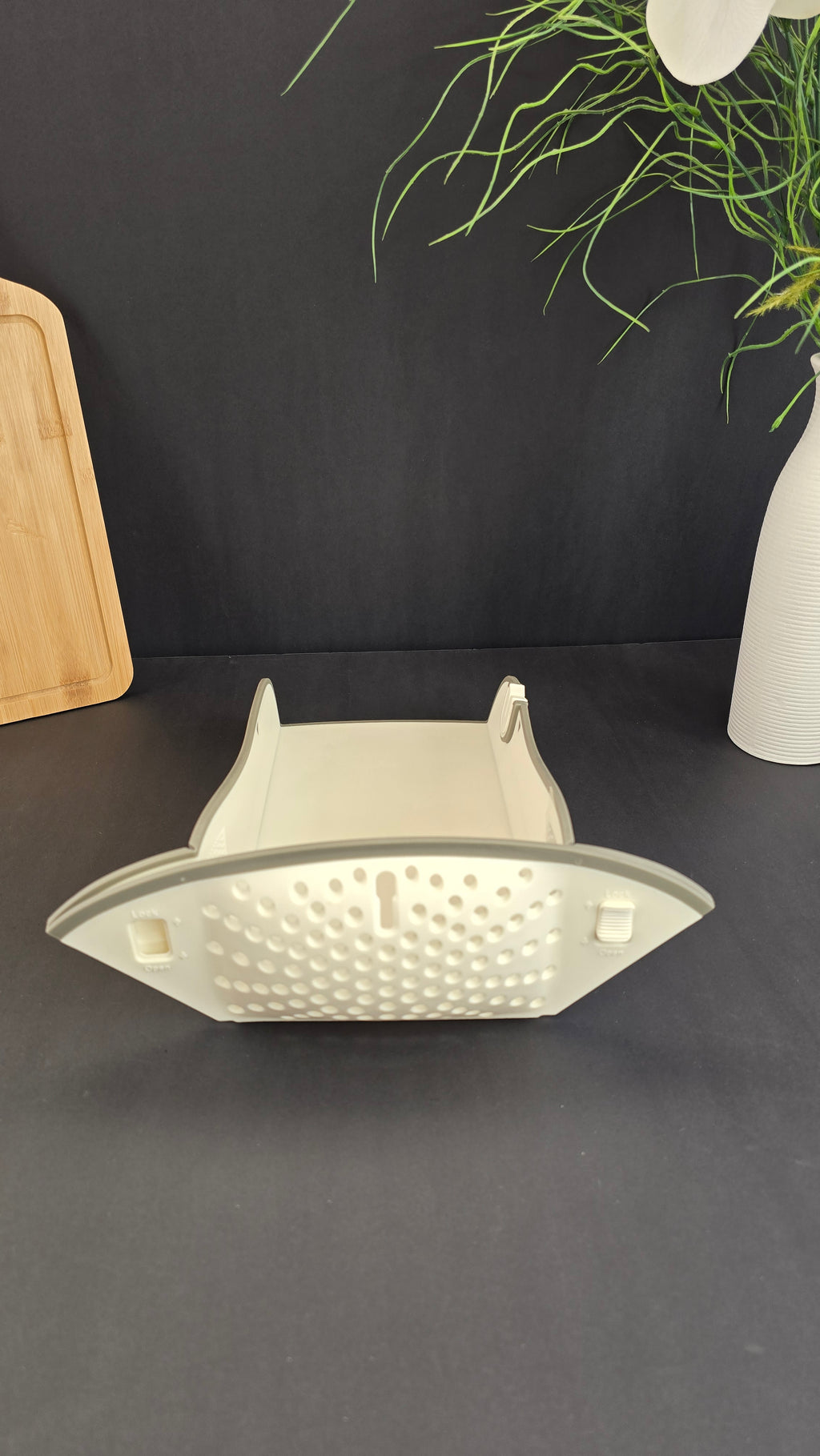 Folded multifunctional cutting board showing its compact space-saving design