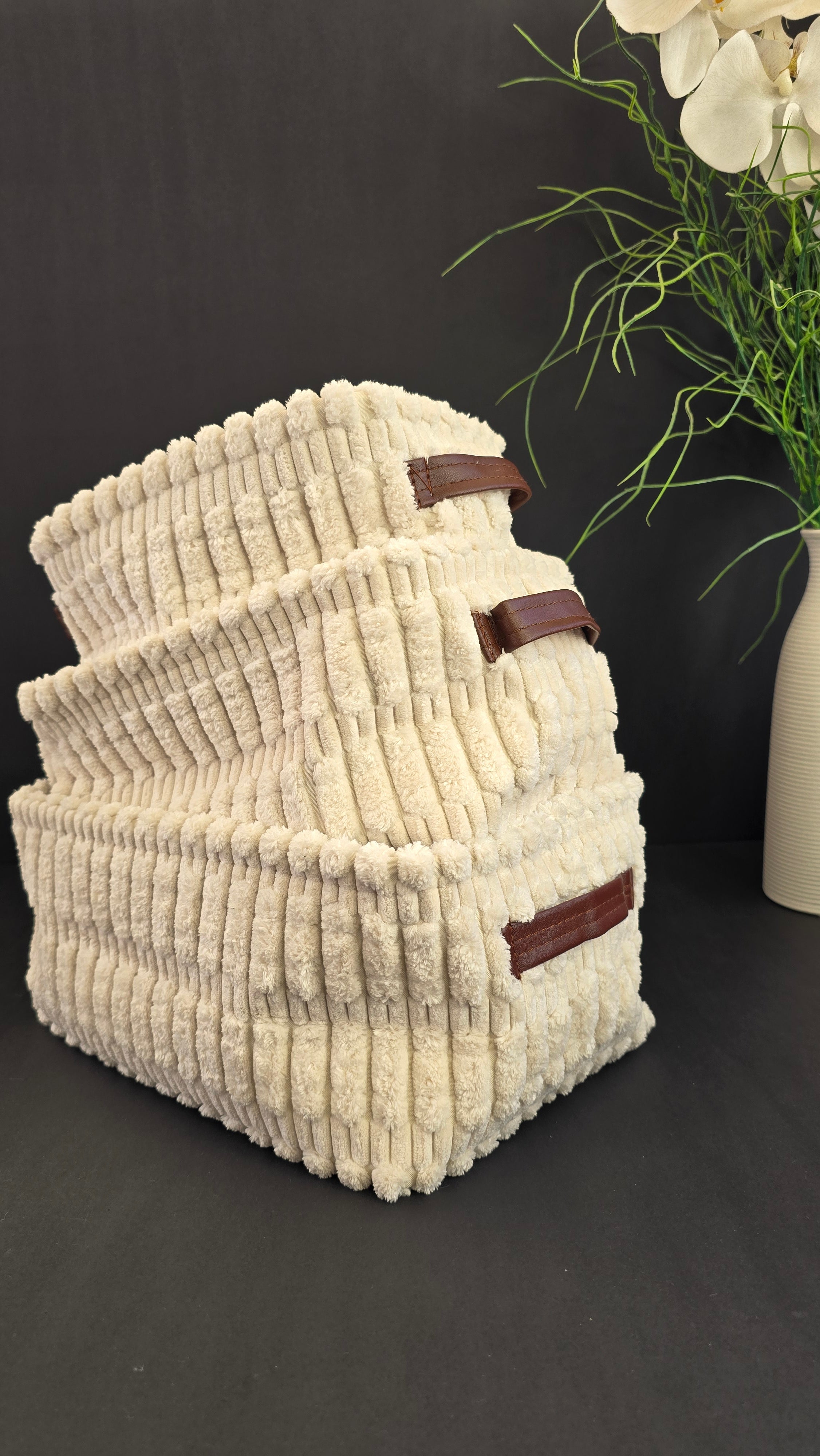 Open three-piece cream nesting storage basket set with soft ribbed texture