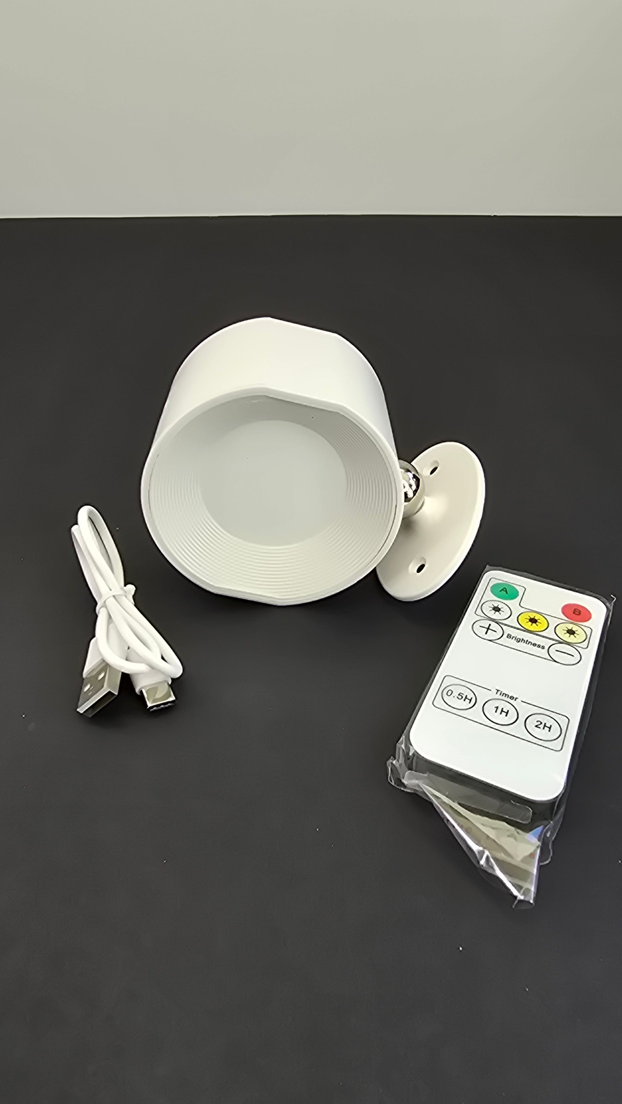 Beiryta white rechargeable LED wall light with remote control and USB charging cable
