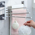 Reverse view of the four stainless-steel towel arms and white mounting rail