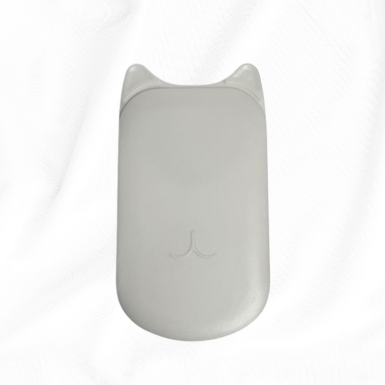 A light gray wireless computer mouse with a subtle cat-ear design on the top, resting on a white fabric background.