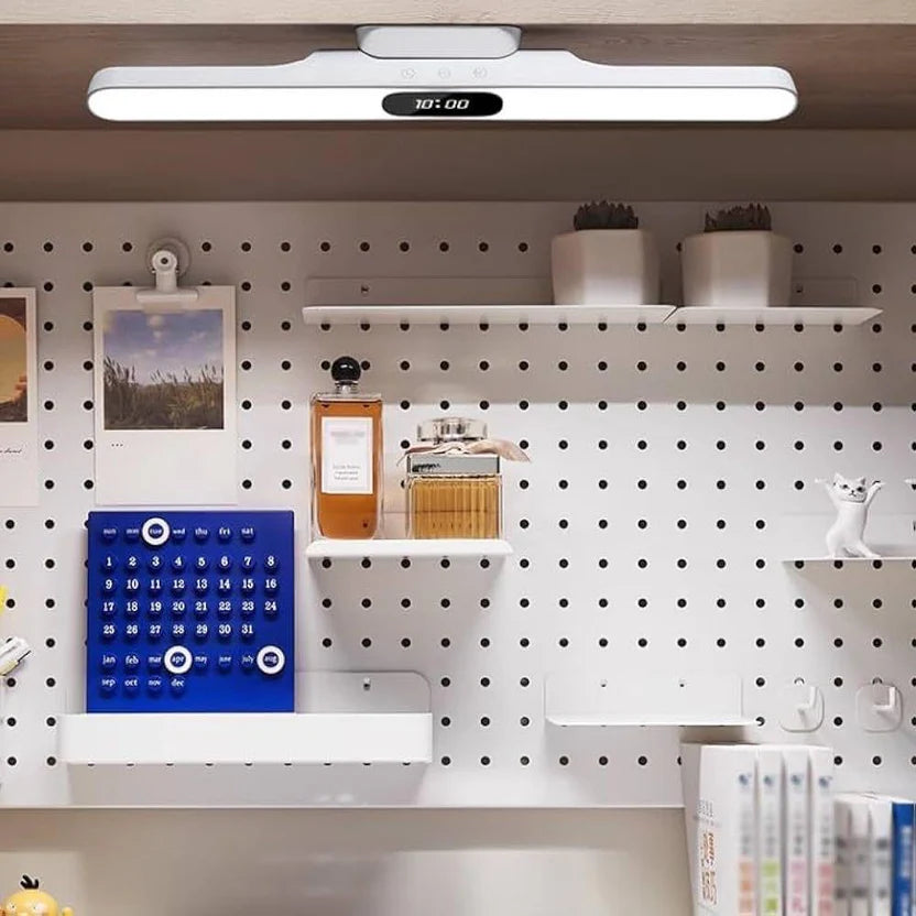 White rechargeable LED light bar with digital clock installed above a home workspace