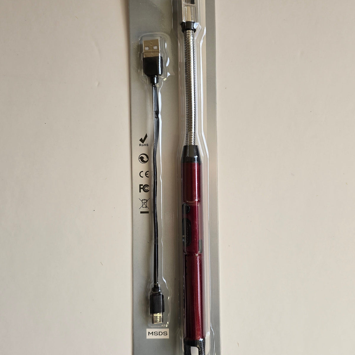 A Samsung Galaxy USB-C to USB-A adapter cable in its original blister packaging, featuring a metallic red pen-style handle and a black cable with a silver USB-C connector on one end and a black USB-A connector on the other.