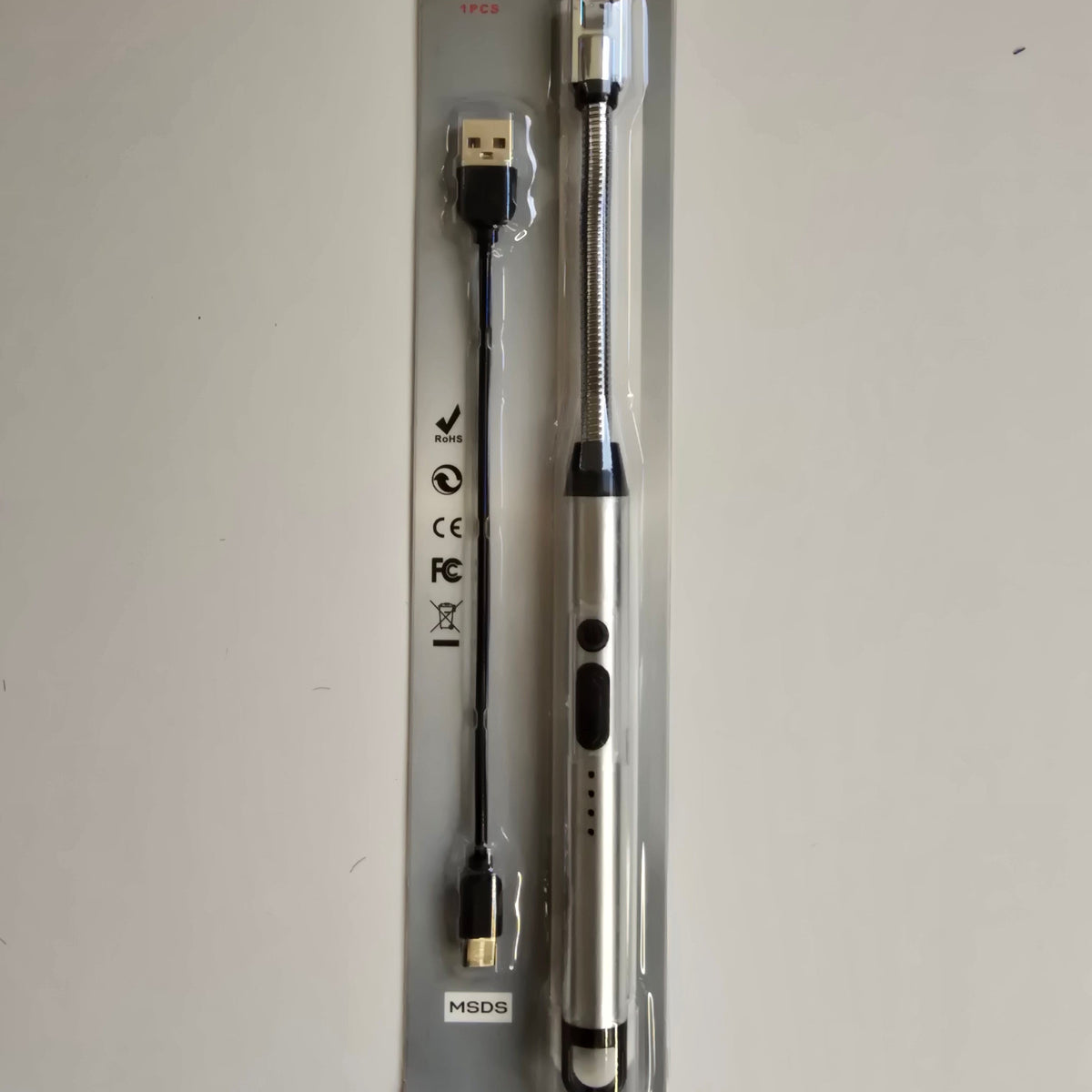 A USB electric screwdriver in its original retail blister packaging, shown against a plain off-white background.