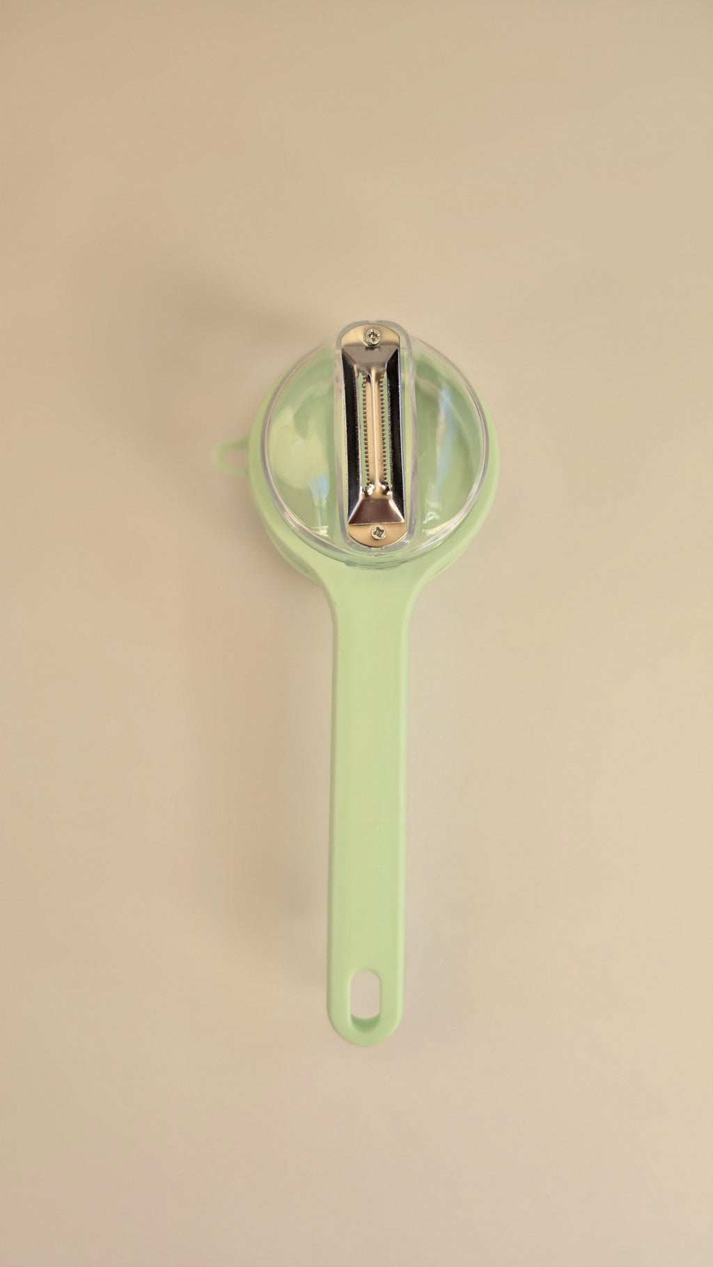 Close-up of the metal blade inside the Beiryta peel-collecting vegetable peeler