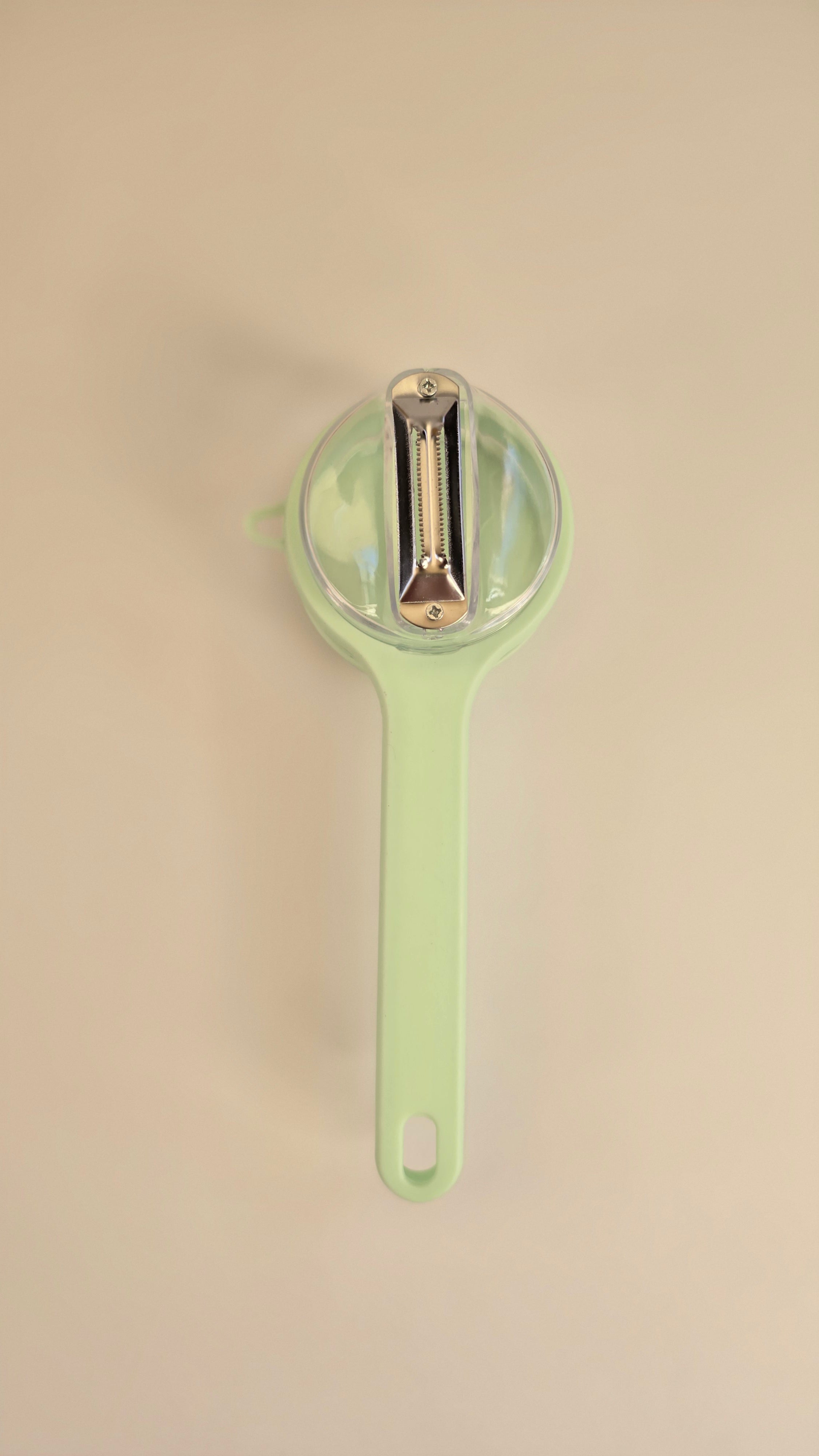 Close-up of the metal blade inside the Beiryta peel-collecting vegetable peeler