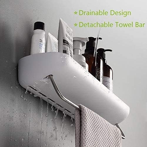 A white wall-mounted bathroom towel bar shelf holding toiletries, with water droplets dripping from the front and a towel hanging from the metal hook. Green text at the top reads 'Drainable Design' and 'Detachable Towel Bar'.