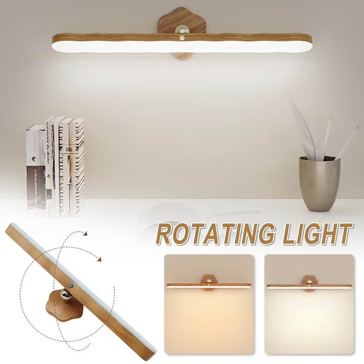 Wooden wall-mounted light fixture with rotating feature on a neutral background