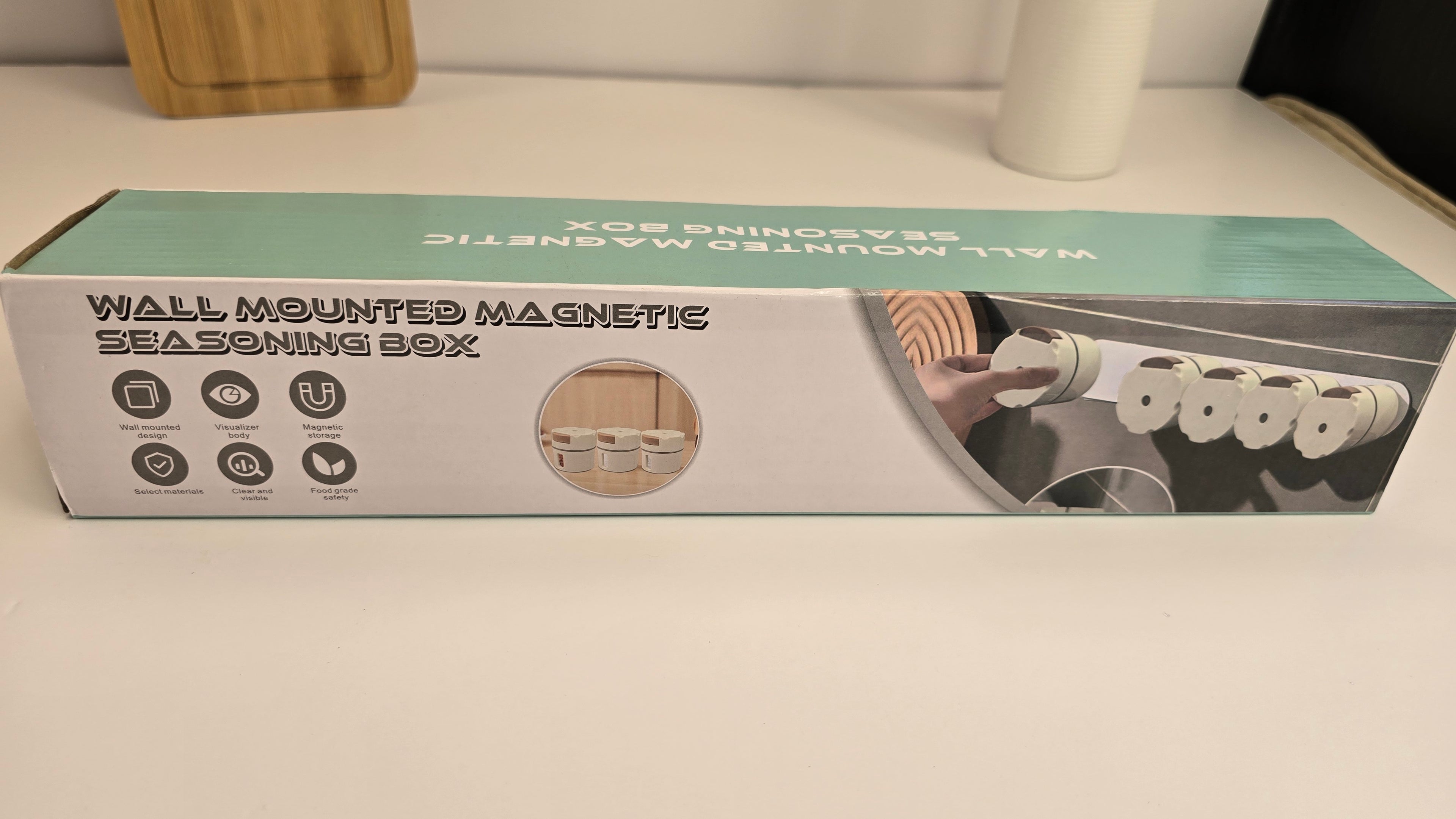 Open magnetic spice dispenser showing the removable seasoning container