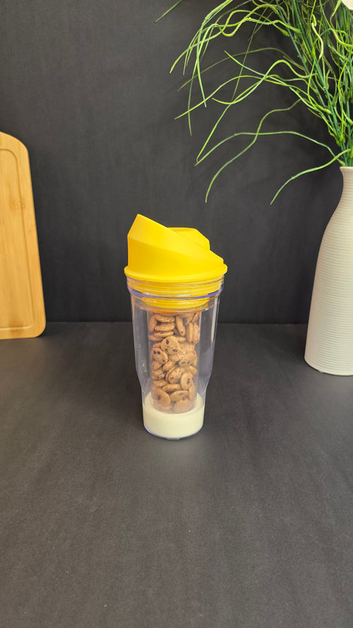 Portable cereal and milk cup with removable yellow cover