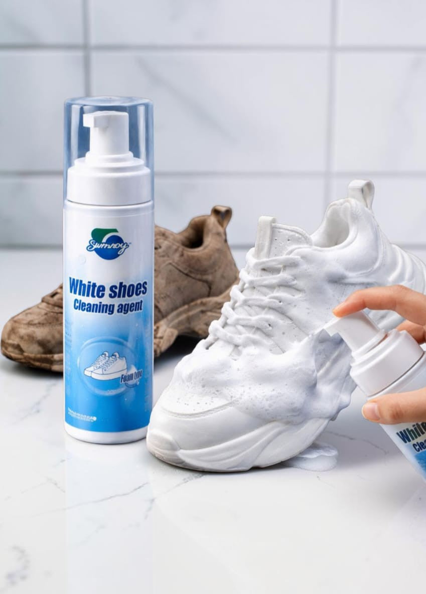 Shoe cleaning foam being applied to a white sneaker