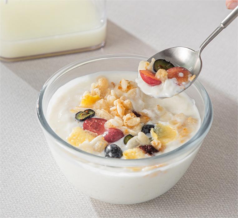 Removable yogurt straining basket separated from the whey container